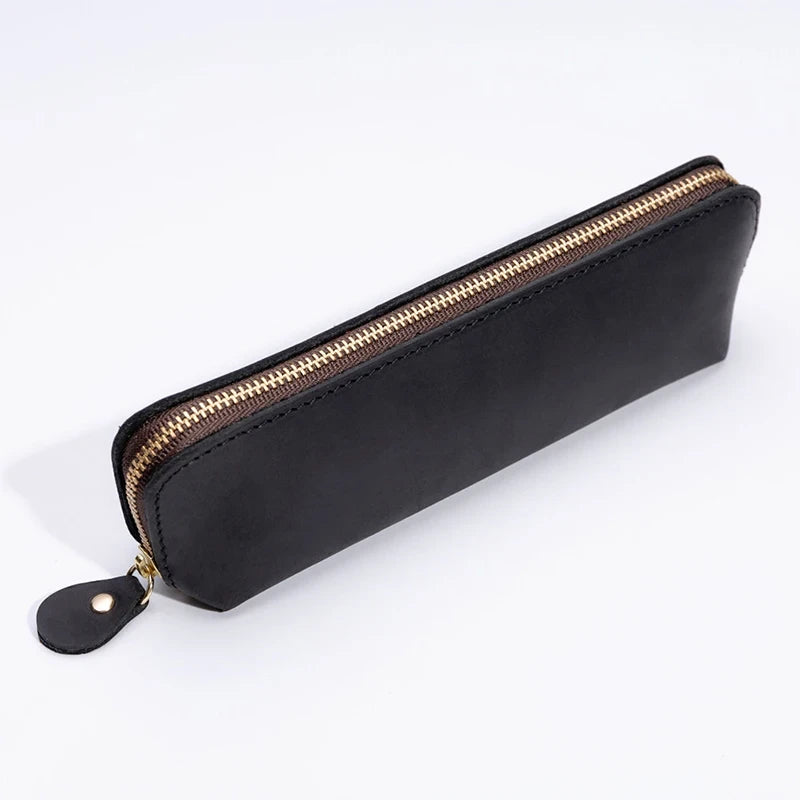 A durable black leather pen case featuring a smooth zipper, front view.