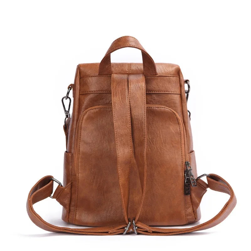 Chic brown leather backpack with a sleek design and comfortable handle and straps - back view