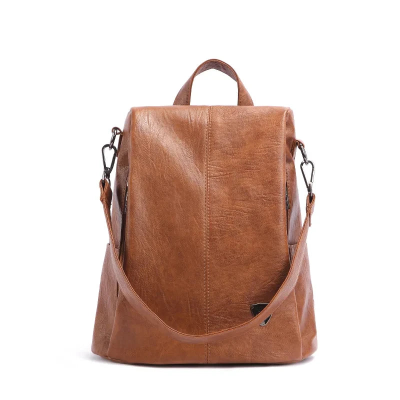 Chic brown leather backpack with a sleek design and comfortable handle - front view