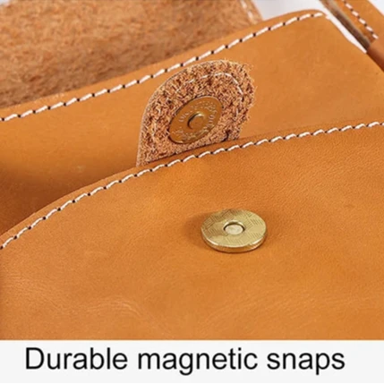 Close-up of durable magnetic snaps on a leather product, showcasing the quality and craftsmanship.