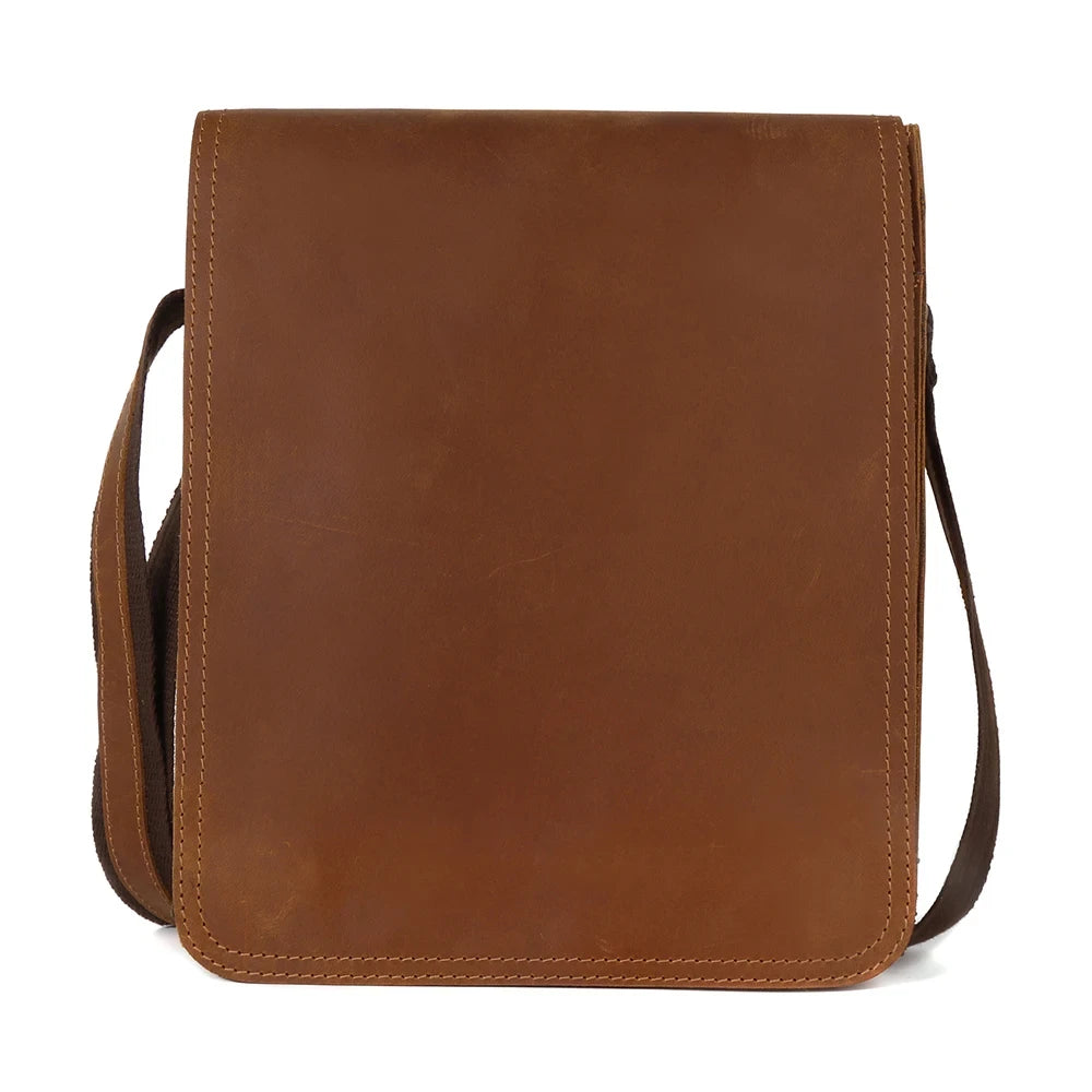 Brown leather crossbody bag, casual style, with minimalistic design, front view variant.