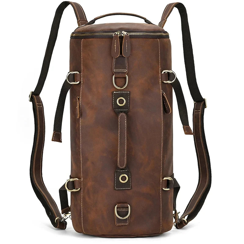Brown leather duffle bag featuring adjustable straps and spacious compartments, front view.