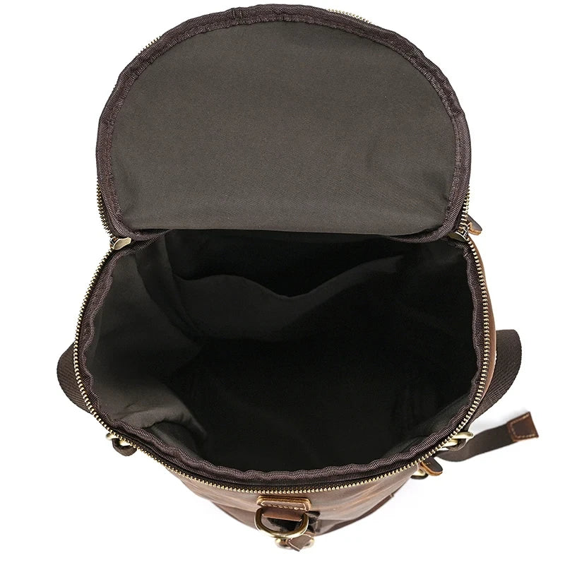 brown bag with the zipper open, showing the spacious, dark interior, ideal for storing everyday items.