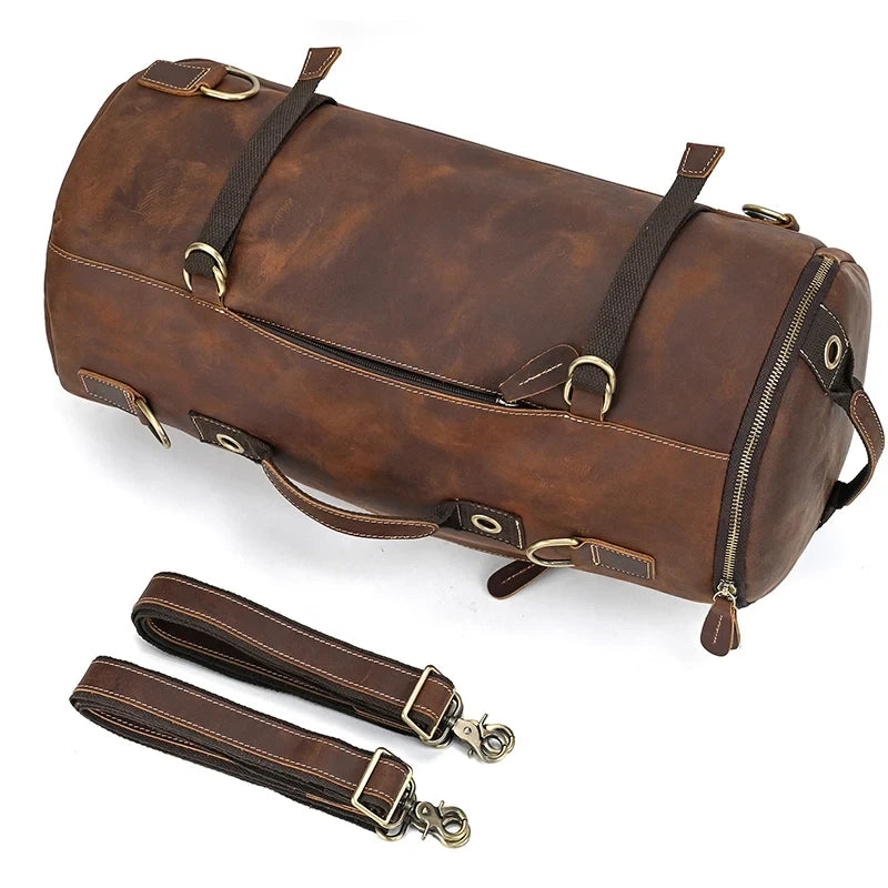 Brown leather duffle bag with handles and detachable straps, front view.