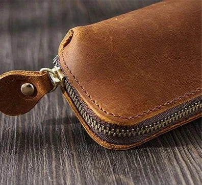 elegant brown leather zippered pen case, displaying sophisticated details and high quality finish.
