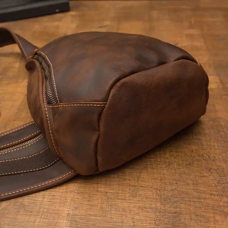 Detailed view of a stylish brown leather bag showcasing its texture and stitching.