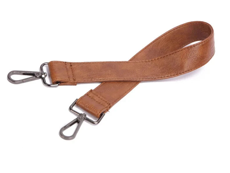 Stylish brown leather bag strap with metal clips.