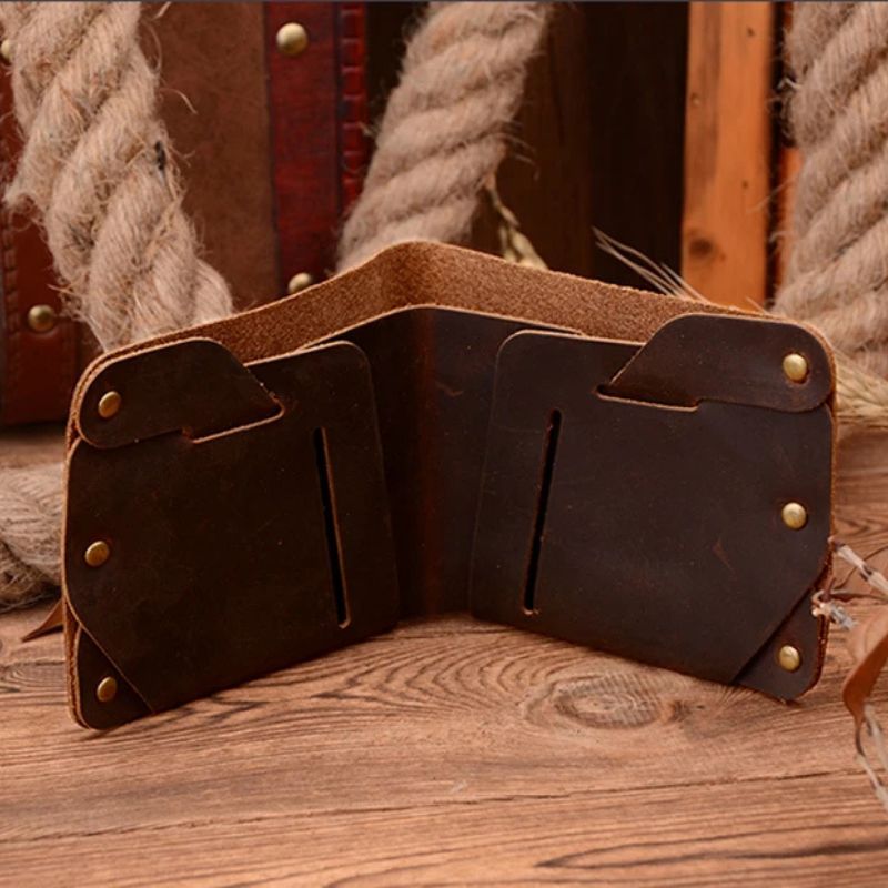Coffee brown leather wallet with compartments for cards and notes on a wooden table, front view.
