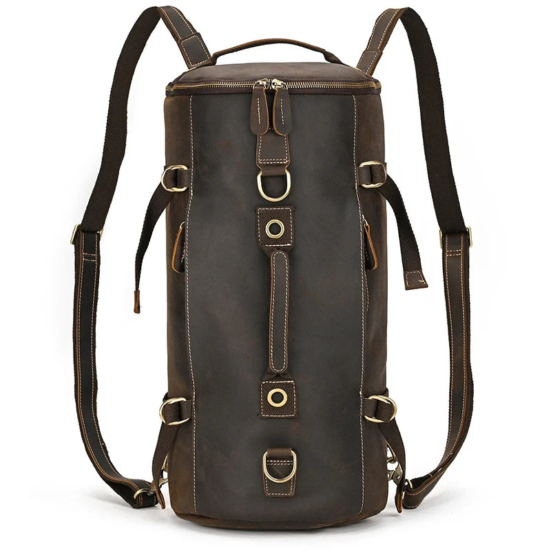 Dark brown leather duffle bag featuring adjustable straps and spacious compartments, front view.