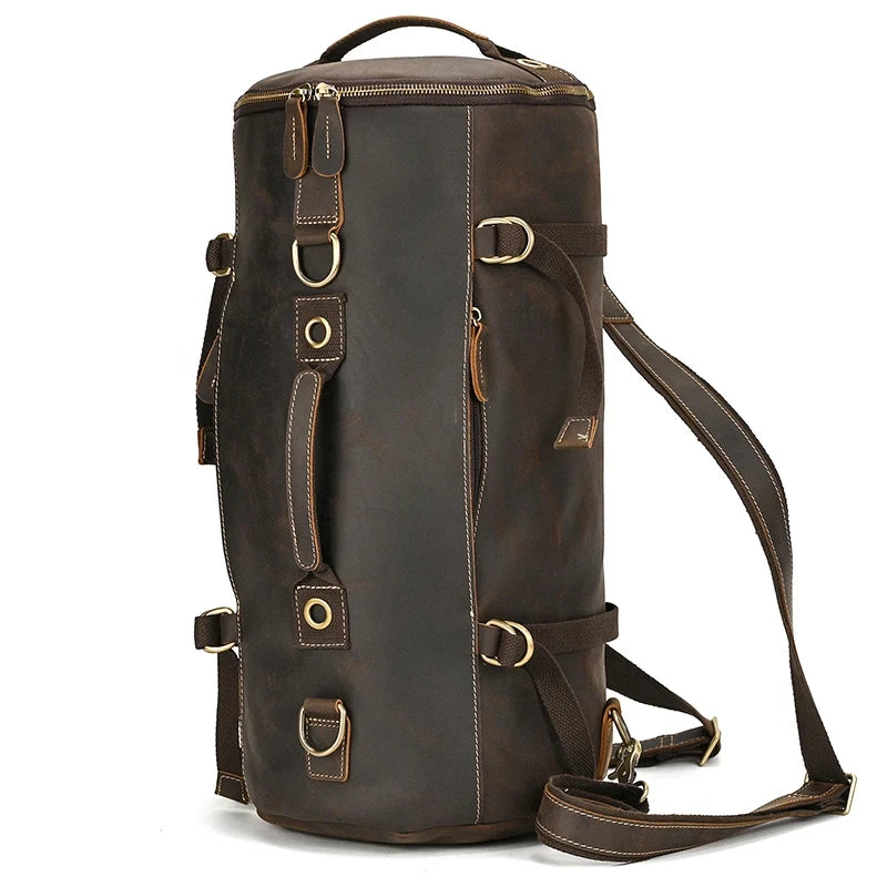Dark brown leather duffle bag, with detachable straps and soft handles and a robust and versatile design, front view.
