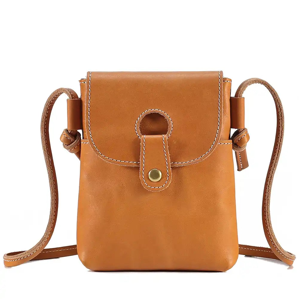 Brown women's leather crossbody bag, with long handle and elegant clasp - front view.