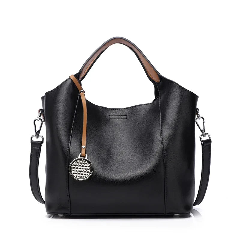 Black leather bag with soft detachable handles and elegant charm, front view - variant.