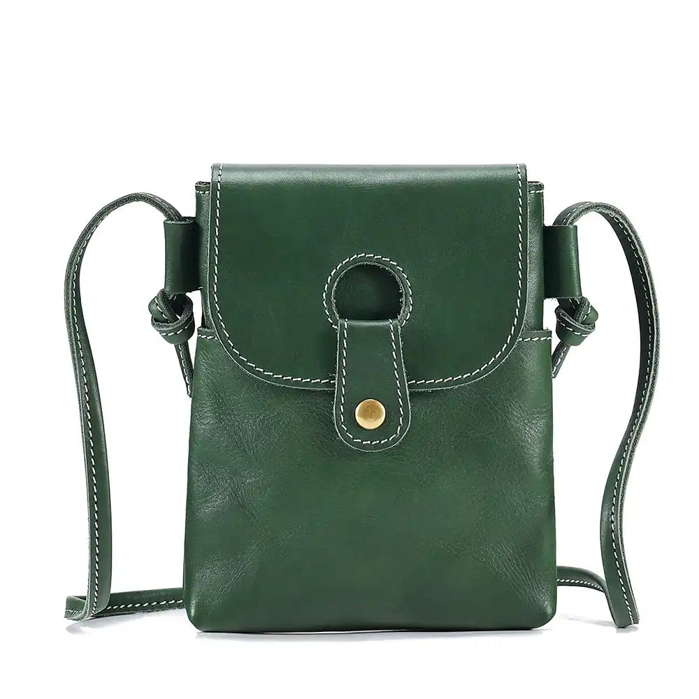 green women's leather crossbody bag, with long handle and elegant clasp - front view.