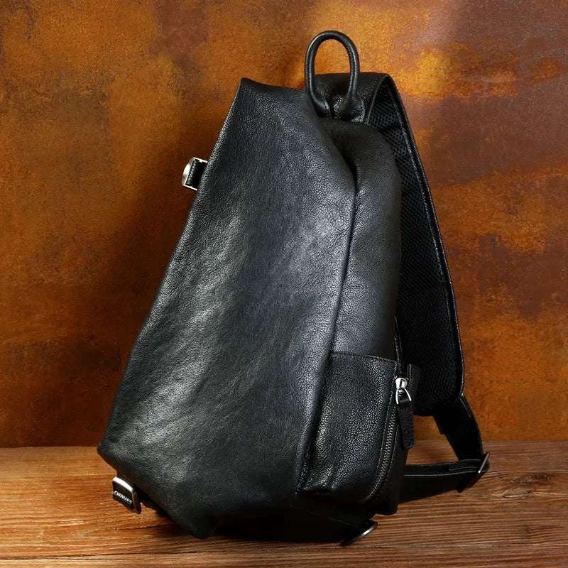 Modern black leather backpack with an ergonomic design and adjustable straps - front view