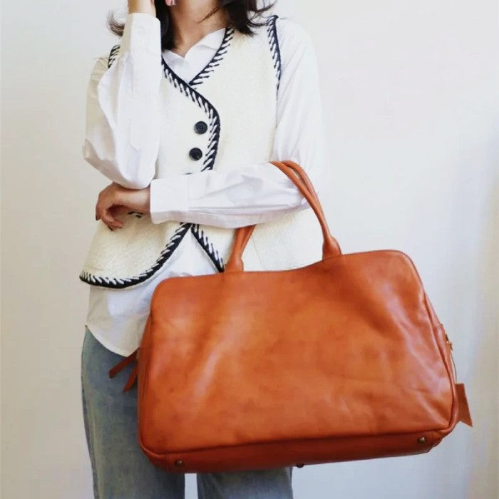 a set of 3 variants of the same leather bag