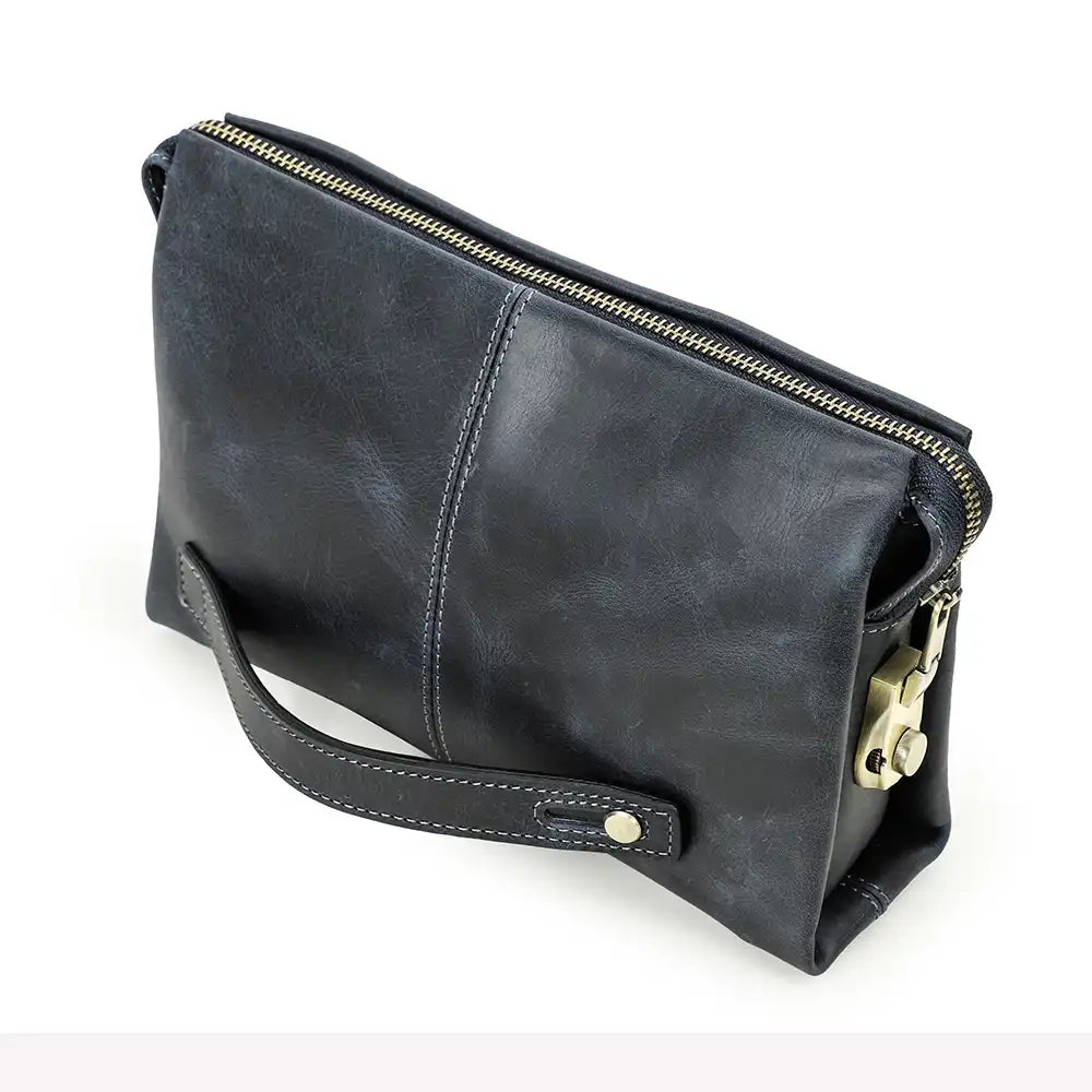Blue clutch bag in durable leather with a zipper and handle, front view.