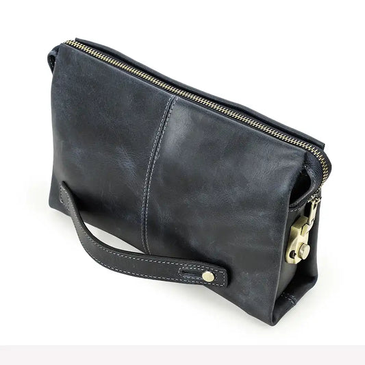 Blue clutch bag in durable leather with a zipper and handle, front view.
