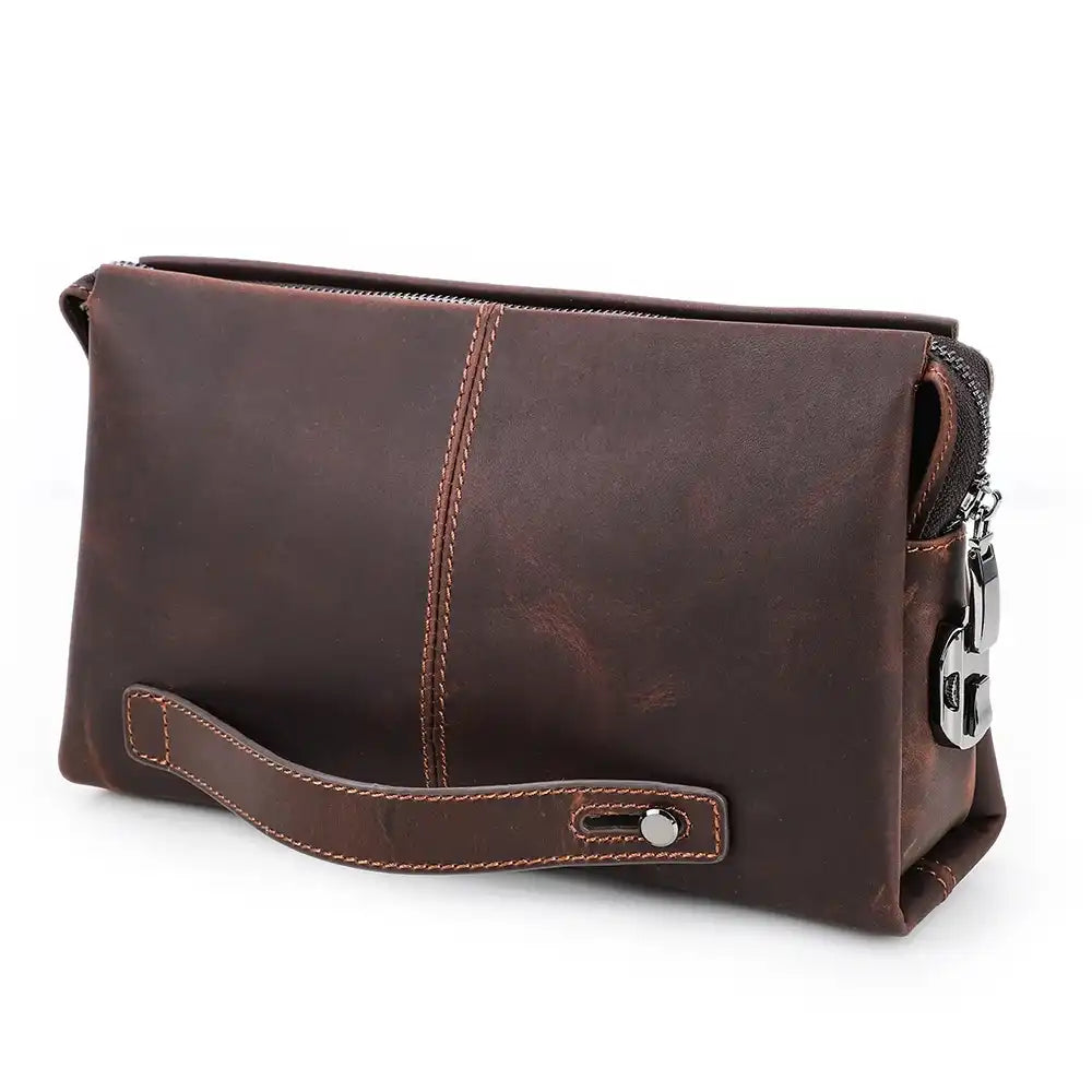 Coffee brown clutch bag in durable leather with a zipper and handle, front view.