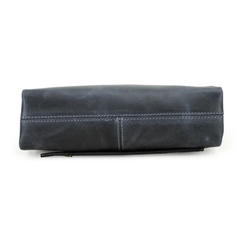 Blue clutch bag in durable leather with a zipper and handle, bottom view.
