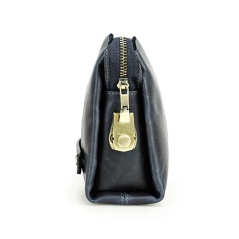 Blue clutch bag in durable leather with a zipper and lock, side view.