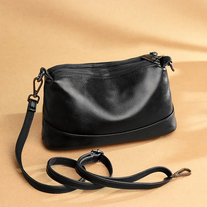 Chic Genuine Leather Shoulder Bag - A versatile black purse featuring a sleek design and adjustable strap