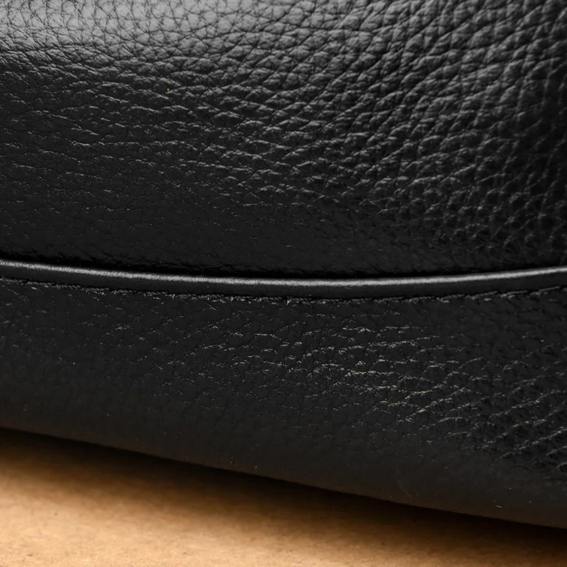 Chic Genuine Leather Shoulder Bag - Close-up of black leather texture showing fine grain and stitching.