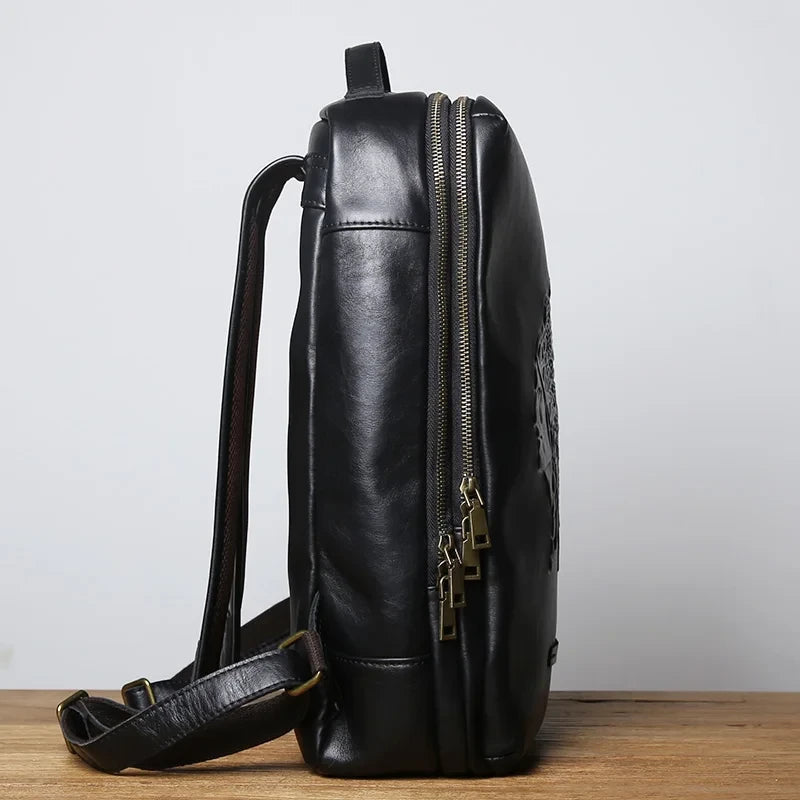 side view of a black leather backpack with elegant design with metal zippers, soft handle and comfortable straps.