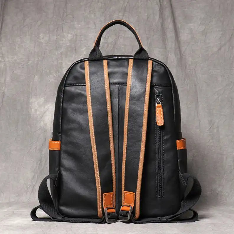 Black leather backpack, with an elegant finish and comfortable straps, back view.