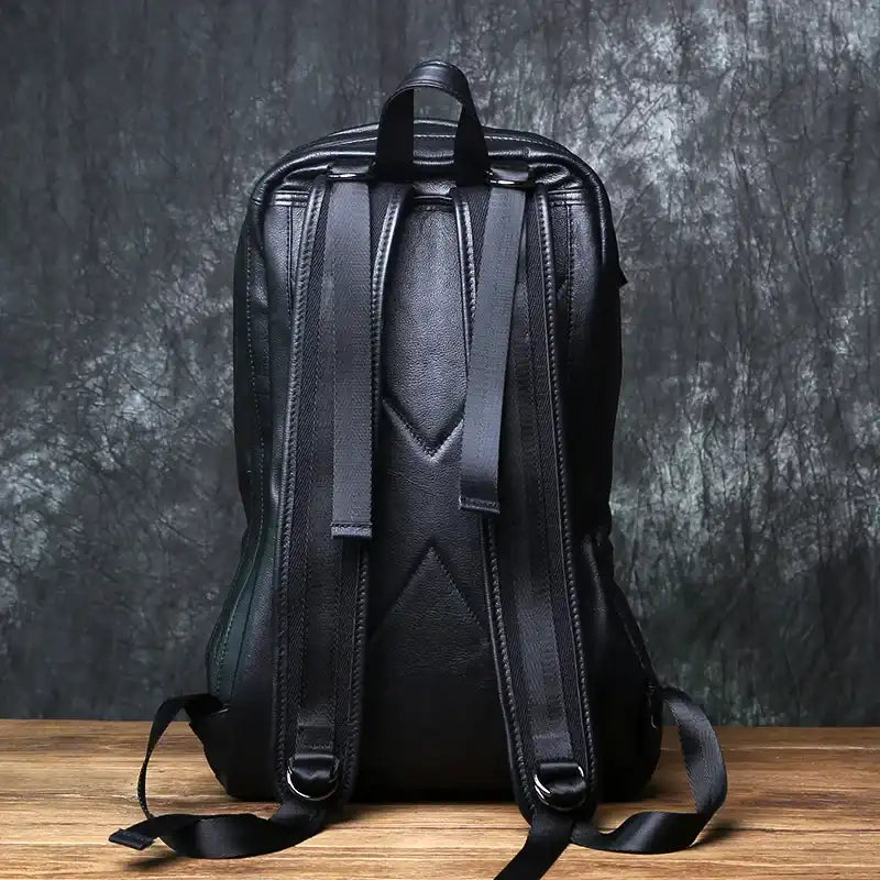 Black leather backpack with an elegant design, back view.