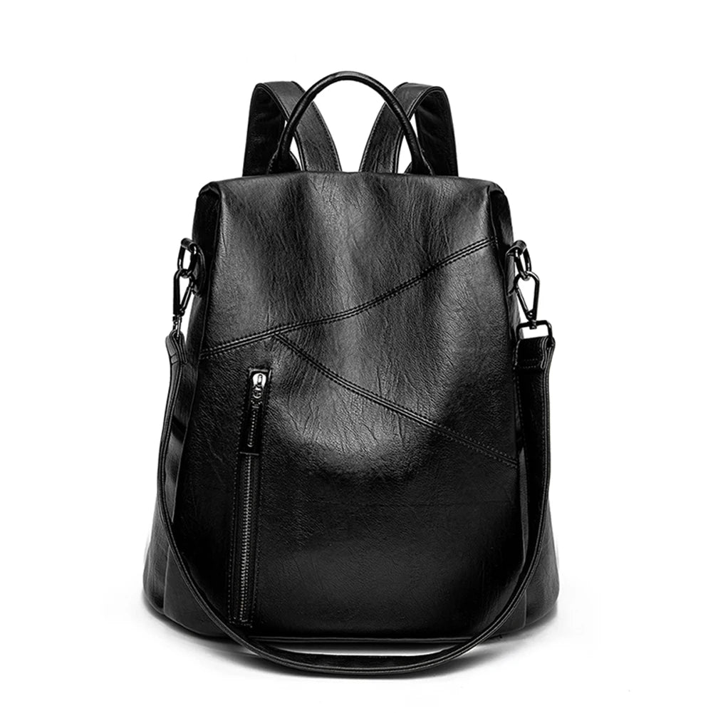 Trendy black leather backpack featuring a sleek exterior and a front zip pocket - front view.