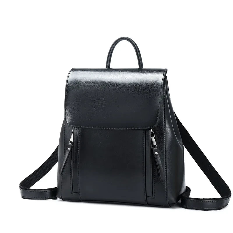 Stylish black leather backpack with zipper pockets, adjustable straps and soft handle - front view