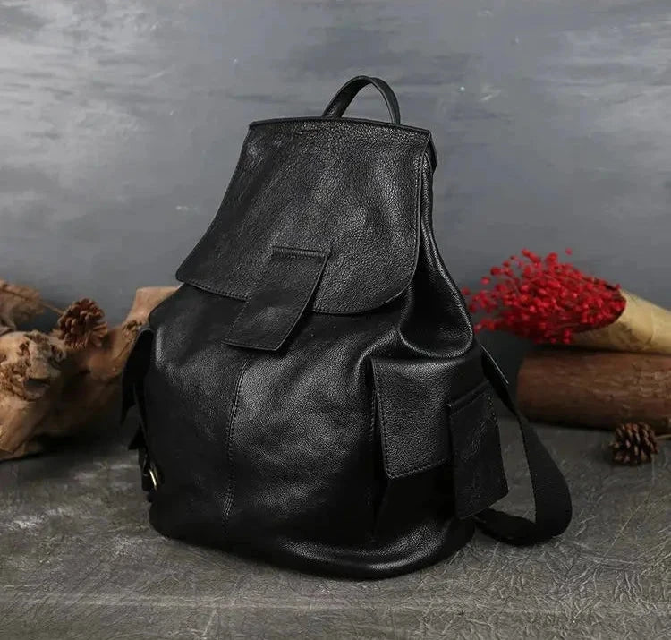 Durable black leather backpack featuring spacious compartments, front view.