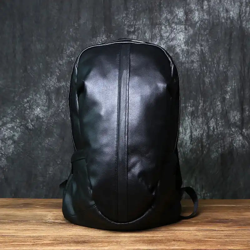 Black leather backpack with an elegant design, front view.