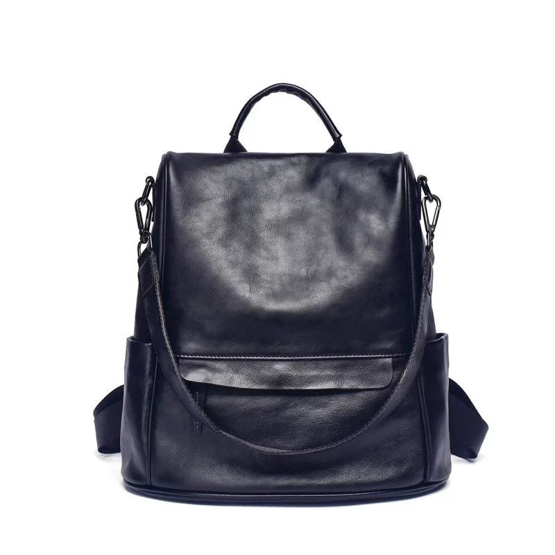 Vintage-inspired black leather backpack with anti-theft design, detachable strap and soft handle, front view.