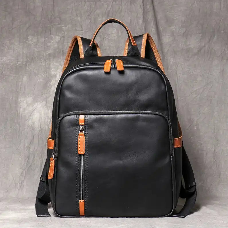 Black leather backpack, with an elegant finish and practical front compartments, front view.