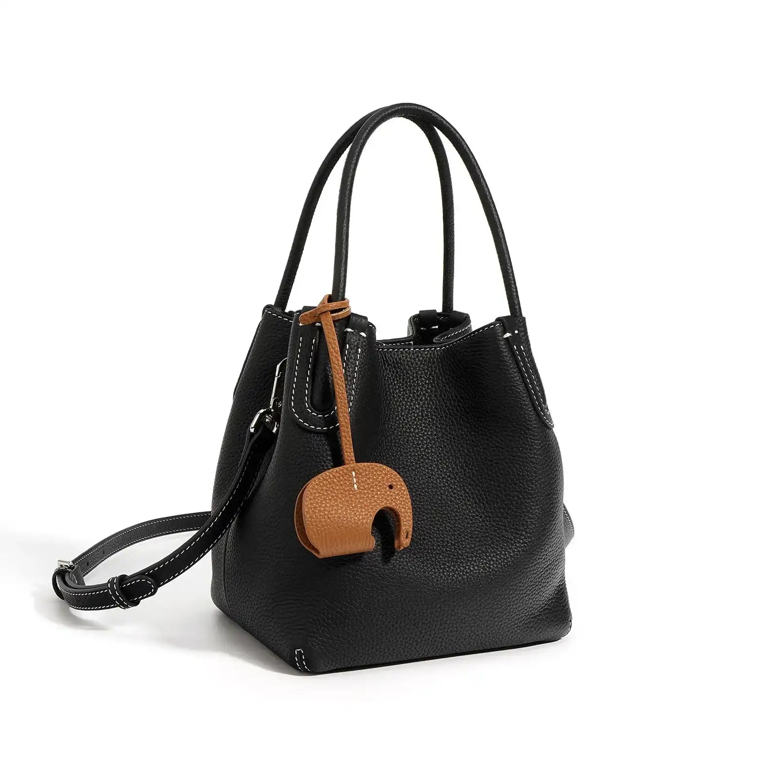 A stylish black leather bucket bag with a unique elephant charm - front view.