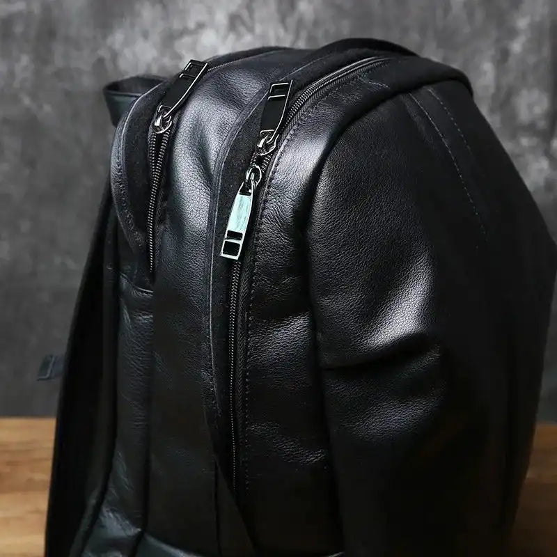 Black leather backback with elegant zippers, and premium material.