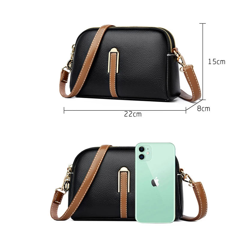 Stylish black leather crossbody bag with dimensions and phone for size reference.