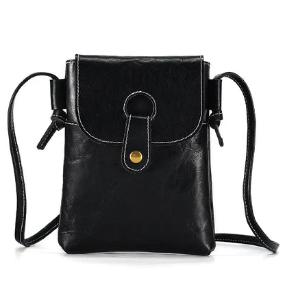 Black women's leather crossbody bag, with long handle and elegant clasp - front view.