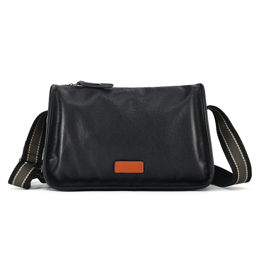 Men's black leather shoulder bag with brown leather detail and adjustable strap, front view.