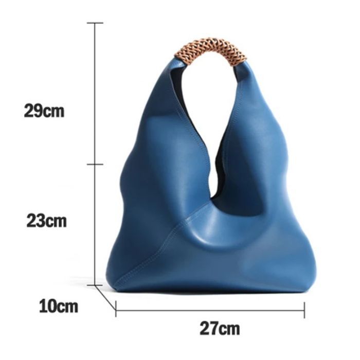 Modern blue leather bag with braided handle, measuring 52 cm high, 27 cm wide and 10 cm deep. Front view.