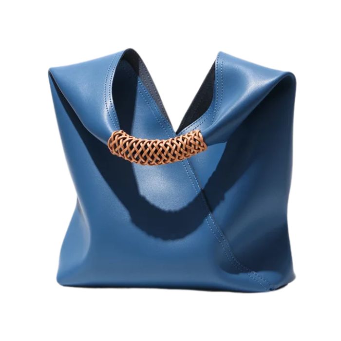 Elegant blue leather handbag with orange braided handle, perfect to complement any casual look, front view. 