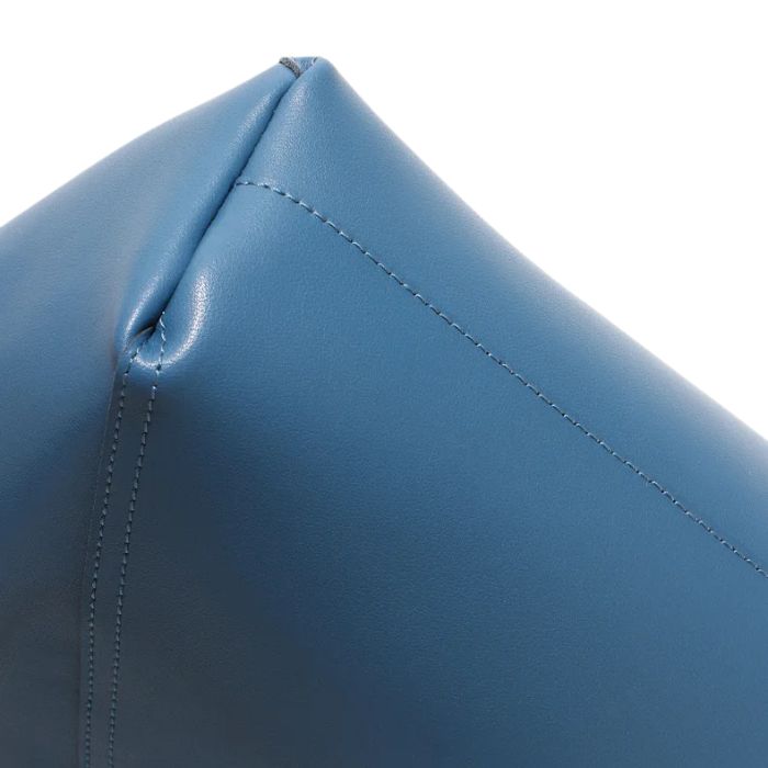 Detail view of a blue leather bag, highlighting the stitching and smooth finish.