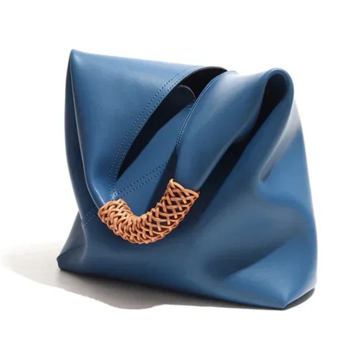 Blue leather bag with braided strap, ideal for various occasions, front view.