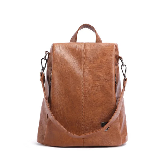 Chic brown leather backpack with a sleek design and comfortable handle - front view