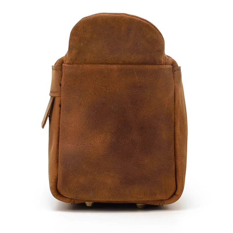 back view of a brown leather clutch with a flap.