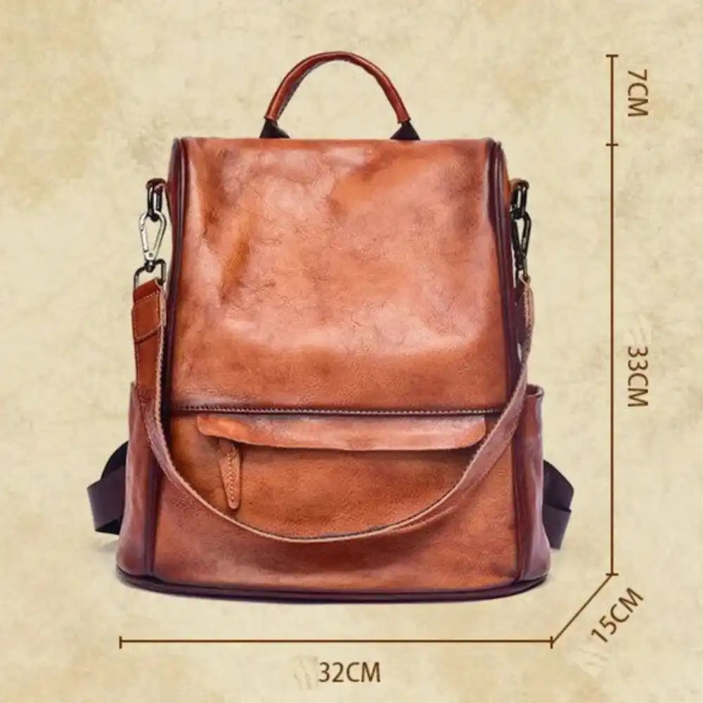 Elegant brown leather backpack, with dimensions of 32cm wide, 33cm high and 15cm deep, front view.