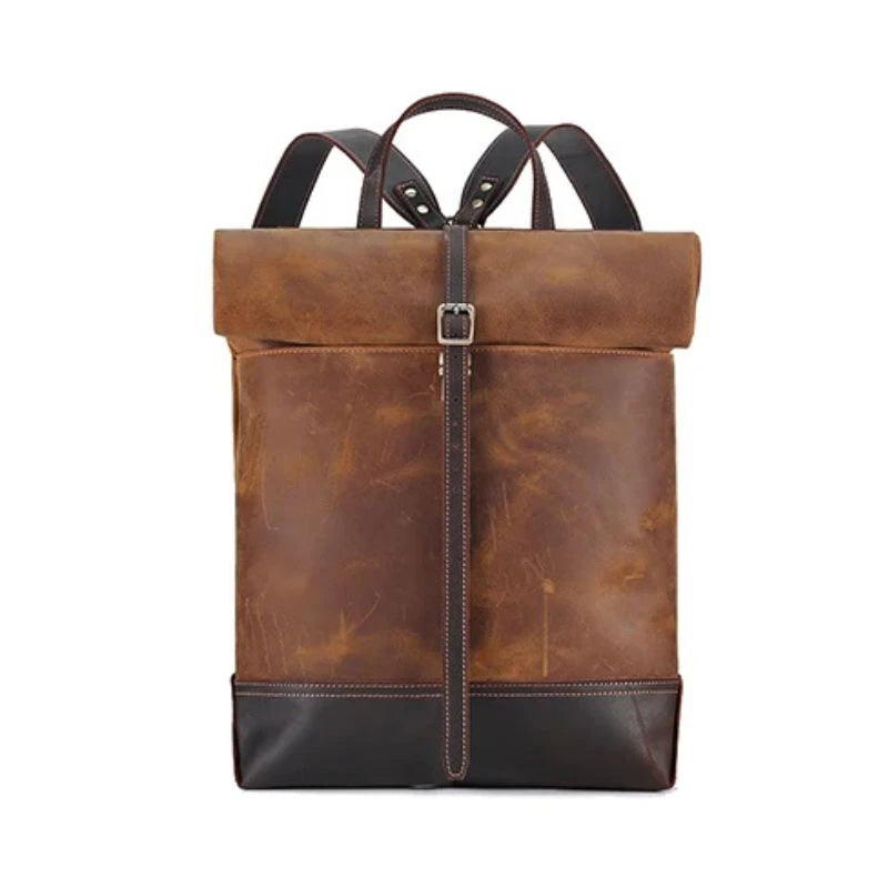 Stylish and durable brown leather backpack with adjustable straps, soft handle and elegant buckle, front view.
