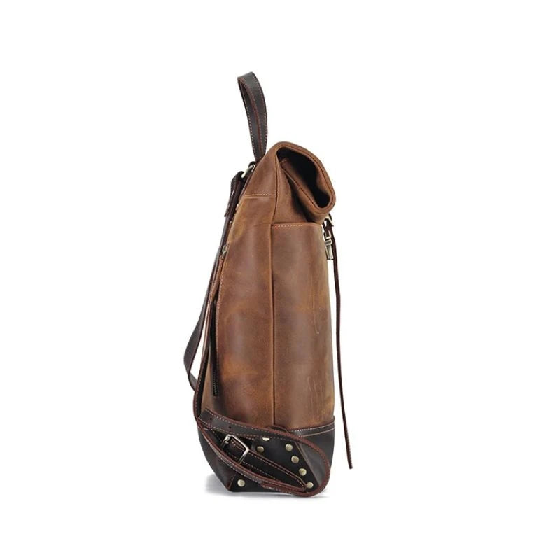 Stylish and durable brown leather backpack with adjustable straps, soft handle and elegant buckle, side view.