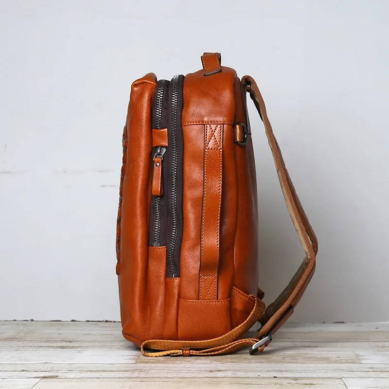 Brown leather backpack side view highlighting its zippers and compact design, ideal for everyday use and travel.